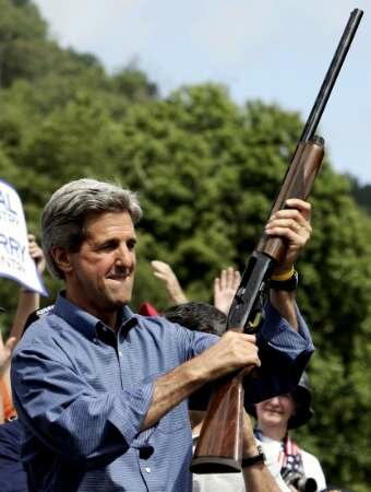 Kerry Carrying Shotgun he voted to ban